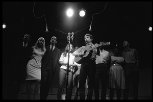 Bob Dylan leading performers on stage, Newport Folk Festival Left to right: Peter Yarrow, Mary Travers, Paul Stookey, Joan Baez, Bob Dylan, Bernice Reagon, Cordell Reagon, Charles Neblett, Rutha Harris, Pete Seeger