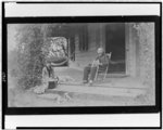 [Grace Ellery Channing Stetson seated with her uncle, William Douglas O'Connor, on porch of the Channing home, 170 N. Orange Grove Ave., Pasadena, California]