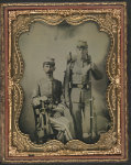 [Two unidentified soldiers in Confederate uniforms with sword, bayoneted musket, and knapsack]