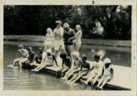 Children Sitting on a Dock