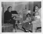 Fr. Hart visits a family