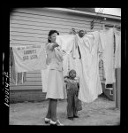 Arlington, Virginia. FSA (Farm Security Administration) trailer camp project for Negroes. Hanging out washing in front of the community building