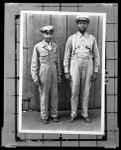 Portrait of two men modeling two styles of uniform for the Refuse Collection Division in Los Angeles, 1920-1930