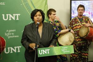 Woman speaking at 20th Anniversary