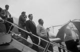 Martin Luther King Jr. getting off a plane at the airport in Birmingham, Alabama.