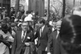 Senator Edward Kennedy being escorted by Atlanta police down Auburn Avenue to Ebenezer Baptist Church for Martin Luther King, Jr.'s funeral.