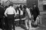 Wilson Baker, a policeman, and a prisoner erecting a wooden barricade on Sylvan Street in Selma, Alabama, during the "Berlin Wall" demonstrations.