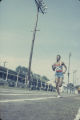 Runner on the track during the annual high school track meet of the Alabama Interscholastic Athletic Association, probably held in Montgomery.