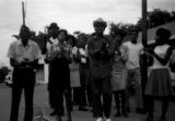 Dan Houser, Lula Williams, Richard Boone, and others, standing at the corner of Day Street and Greyhound Street in Montgomery, Alabama, during a civil rights demonstration.