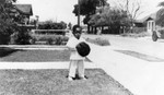 Thumbnail for Boy in suit in front yard