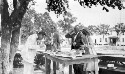 Unidentified people eating watermelon