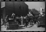 [Untitled photo, possibly related to: Some of the negroes watching itinerant salesman selling goods from his truck in center of town on Saturday afternoon, Belzoni, Mississippi Delta, Mississippi]