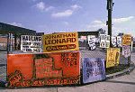 Fence with signs, Martin Luther King Blvd. at S. Crenshaw Blvd., Los Angeles, 1996