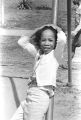 Sheyann Webb leaning against a swingset in George Washington Carver Park in Selma, Alabama, during a commemoration of the Selma to Montgomery March.