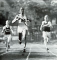 Sprinter Ralph Metcalfe crosses tape ahead of runners from Michigan State and Wisconsin, 1933