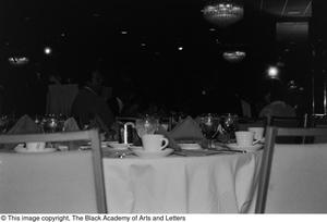 Photograph of dining seats placed next to a table of the dining area