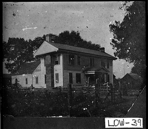 Photograph of man standing in front of Berry Wells plantation home, Lowndes County, Georgia, not before ca. 1860