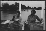 Negro stevedores eating on stern of boat. Food supplied to crew consists almost entirely of carbohydrates with some of the cheaper cuts of meat. Sleeping quarters are not provided for stevedores, who sleep in any available space. Aboard El Rito, Pilottown, Louisiana