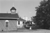 Church on dirt street.