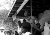 Edward Rudolph and others, standing on the porch of the Autauga County Improvement Association office in Prattville, Alabama, on the day of a civil rights march.