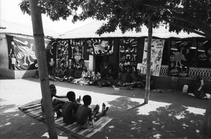 Appliqué workers, in street, Abomey, Benin