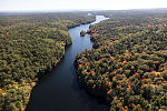 An October 2017 aerial view of Maine forestland and Chase's Pond, which here and in many other spots looks more like a river than a lake, near York