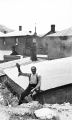 [Helena, Montana, Reeder's Alley, Jim Jackson waving in foreground].