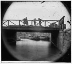 [Richmond, Va. Bridge over the Canal; barges beyond]