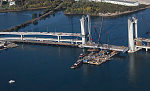 An October 2017 aerial view of the historic seaport of Portsmouth, New Hampshire, the largest city along the shortest coastline (18 miles) of any U.S. state. The focus is on the new Sarah Mildred Long Bridge, a span set to open approximately one month after the date of this photograph