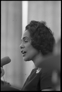 Coretta Scott King addressing the Solidarity Day crowd at the Poor People's March on Washington, speaking against the War in Vietnam Portrait in profile, at the microphones