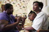 Nurse giving a child a vaccine shot at the Madison County Health Department on Eustis Avenue in Huntsville, Alabama.