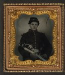 [Unidentified soldier in Union uniform with dual revolvers and saber]