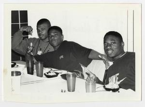 Photograph of Three Men in Cafeteria