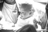 Percy Jones, Jr., holding his daughter Barbara in his home on Clayton Alley in Montgomery, Alabama.