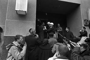 Sheriff Jim Clark attempting to arrest or remove C. T. Vivian from the steps of the Dallas County courthouse during a voting rights demonstration in Selma, Alabama.