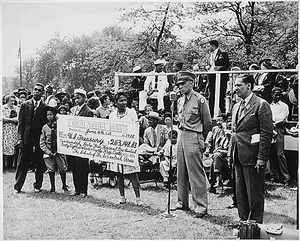 "...the public school children of the South-Central District of Chicago purchased $263,148. 83 in war bonds and stamps...a huge check representing enough money for 125 jeeps, two pursuit planes and motorcycle was presented to Maj. C. Udell Turpin of the Illinois War Bond Sales staff."