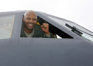 Recording artists Rodney Ellis, a member of the Rhythm and Blues music group "Kool and the Gang", sticks his head out of the cockpit window of a US Air Force (USAF) B-52 Stratofortress aircraft during the groups visit to Barksdale AFB, Louisiana (LA). Members of the group "Kool and the Gang" toured the base, signed autographs, and raffled off tickets to military personnel before their concert at a local casino that night