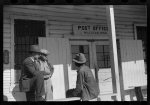 [Untitled photo, possibly related to: Mr. Jones, one of the owners of Marcella Plantation, with manager of Goodhope Plantation talking to one of Negro tenants on porch of Plantation store and post office, Mileston, Mississippi Delta, Mississippi]