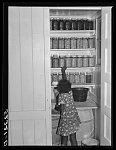 Closet of canned goods and salt pork belonging to Cube Walter's family, Negro tenant purchase client. Belzoni, Mississippi Delta, Mississippi