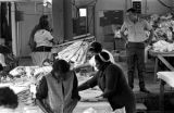 Women ironing blouses made at Tuskegee Mills in Macon County, Alabama.