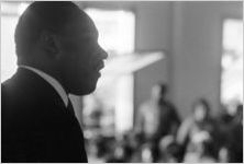 Martin Luther King, Jr., speaking to an audience in a church building, probably First Baptist Church in Eutaw, Alabama.