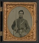 [Unidentified cavalry soldier in Union uniform with two revolvers and a saber]